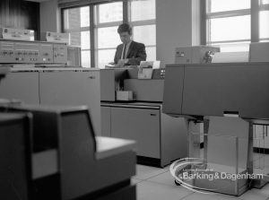 London Borough of Barking, Treasurer’s Department Computer Room at Civic Centre, Dagenham, looking south-west, with equipment and member of staff, 1969