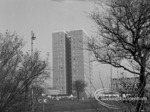 Becontree Heath housing development, showing tower block on north side, framed by trees and shrubs on south, 1969