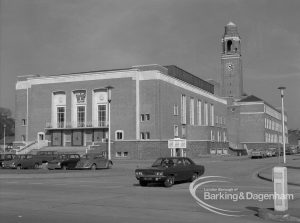 Barking Assembly Hall from south-east, with car in foreground and Town Hall clocktower in background, 1969