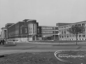 Civic Centre, Dagenham, with portico on main building, extension on right and deserted road, 1969