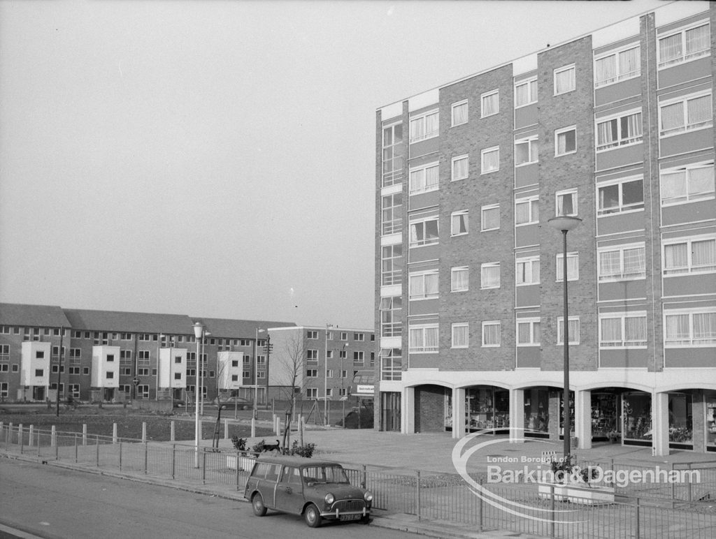 Becontree Heath housing development, showing north end of flats above parade of shops east of Merry Fiddlers Public House [possibly in Althorne Way, Dagenham], and housing in Wood Lane, 1969