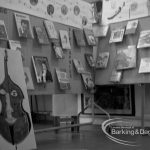 Barking Libraries Children’s Book Week at Valence House, Dagenham, showing exhibition of children’s books with cutout of cello and music display, 1969