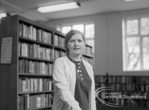 London Borough of Barking Rectory Library, Dagenham, showing Mrs Ann Harrison shelving in adult section, 1969
