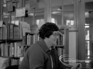 London Borough of Barking Rectory Library, Dagenham, showing Miss Hilda Godfrey at counter in adult section, 1969