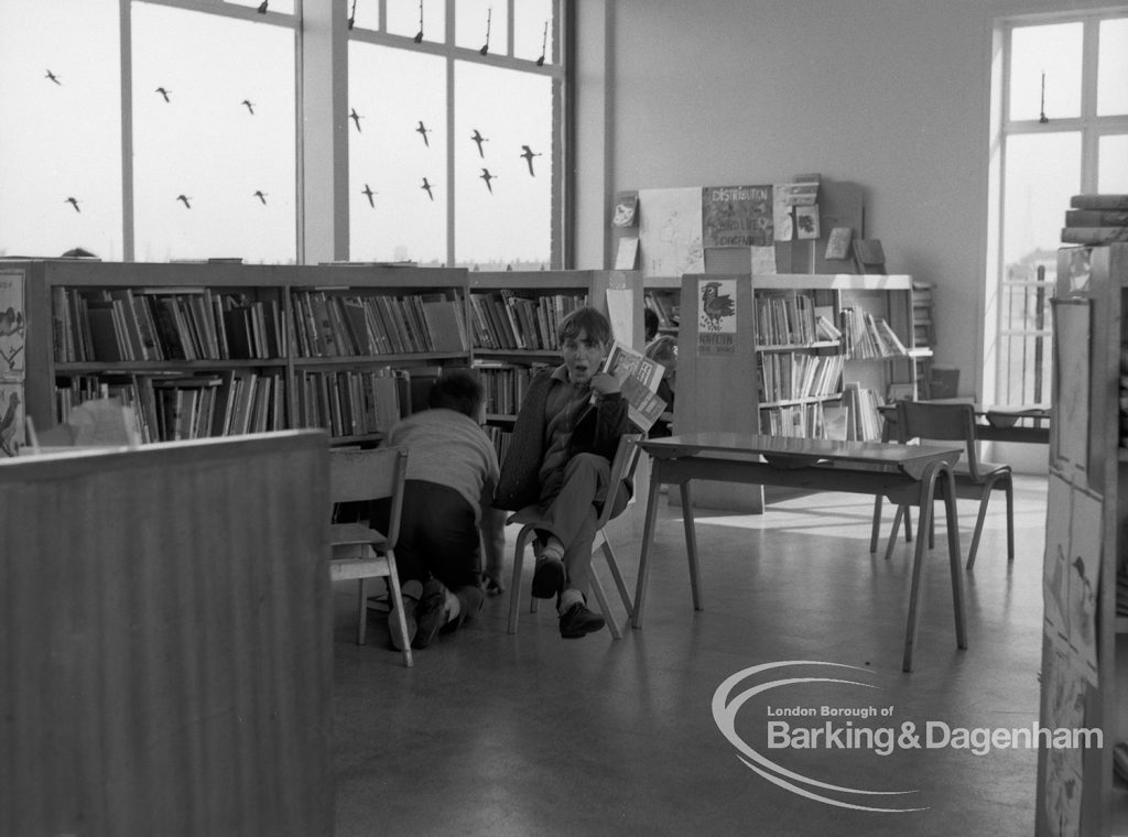 London Borough of Barking Rectory Library, Dagenham, showing view in junior section looking south and two boys, 1969