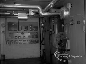 London Borough of Barking Borough Engineer, Heating and Ventilation, showing boiler house with boiler on right and control panel on far wall at Riverside Old People’s Home for Senior Citizens, Thames View, 1969