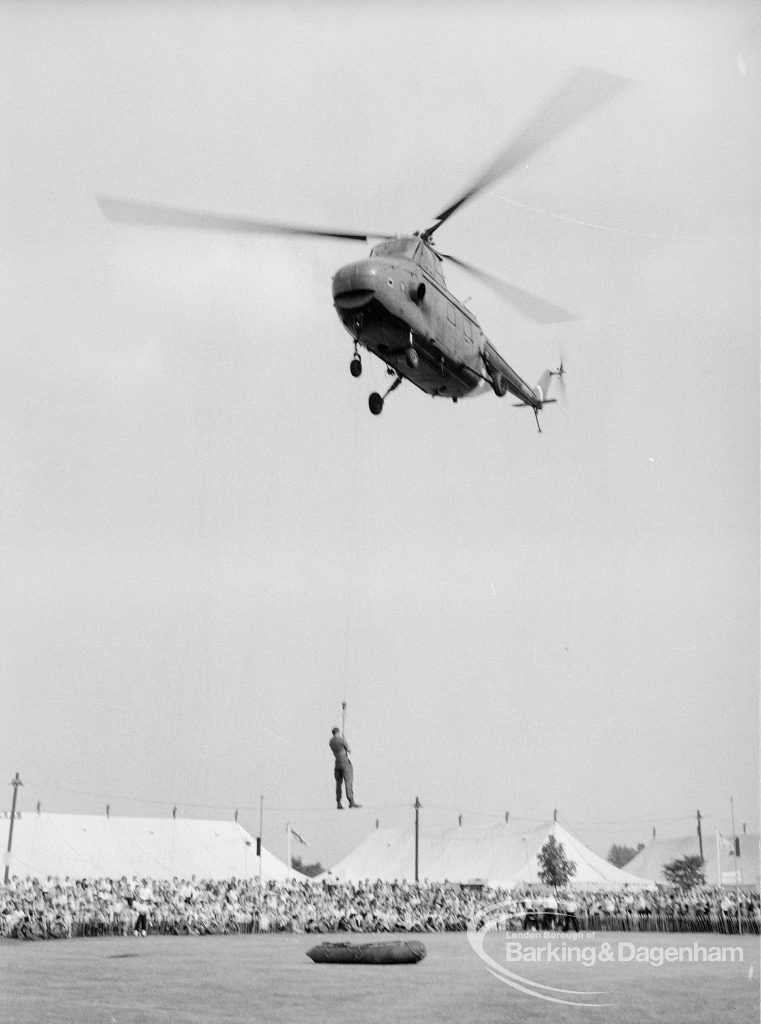 Dagenham Town Show 1969, showing helicopter lowering soldier into Arena with audience watching, 1969