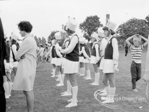 Dagenham Town Show 1969, showing majorettes standing in line, and with woman and boy, 1969