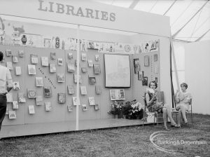 Dagenham Town Show 1969, showing Libraries stand with Arts and Crafts display, with staff including Miss M Clark at right, 1969