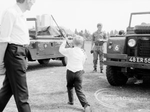 Dagenham Town Show 1969, showing Army display with boy brandishing rifle, 1969