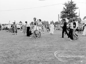 Dagenham Town Show 1969, showing visitors passing across Fairground, 1969