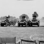Dagenham Town Show 1969, showing soldiers in armoured vehicles approaching in line abreast, 1969