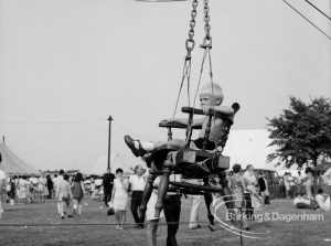 Dagenham Town Show 1969, showing close-up of boy in bosun’s chair on wire slide, 1969