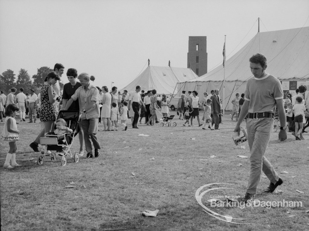 Dagenham Town Show 1969, showing competitor (at right) and visitors, with marquees behind, 1969