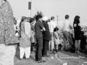 Dagenham Town Show 1969, showing a family and other visitors standing and watching an event, 1969