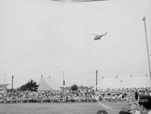 Dagenham Town Show 1969, showing helicopter flying above arena audience and marquee, 1969