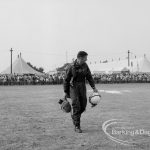 Dagenham Town Show 1969, showing parachute jumping, with parachutists leaving arena after packing parachutes, 1969