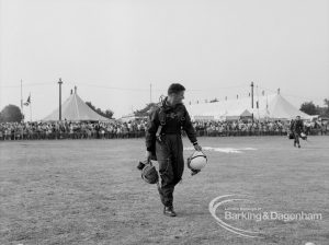 Dagenham Town Show 1969, showing parachute jumping, with parachutists leaving arena after packing parachutes, 1969