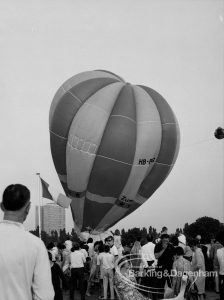 Dagenham Town Show 1969, showing hot-air balloon on ground and inclining right, behind spectators in foreground, 1969
