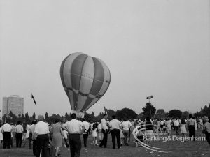 Dagenham Town Show 1969, showing hot-air balloon on ground, behind crowd of spectators in foreground, 1969