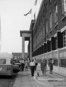Dagenham Town Show 1969, showing group of visitors leaving and crossing front of Civic Centre, 1969
