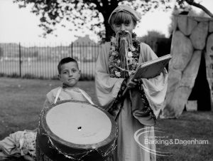 Rectory Library, Dagenham production of ‘The Price of Wisdom’ in grounds of library, produced by Mrs Jean Hickman, showing standing ‘wise man’ with young drummer, 1969