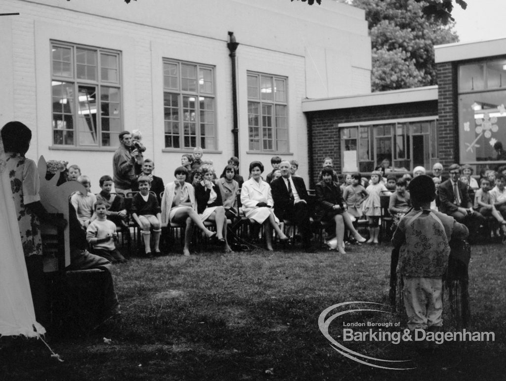 Rectory Library, Dagenham production of ‘The Price of Wisdom’ in grounds of library, produced by Mrs Jean Hickman, showing audience seen from ‘stage’, with library beyond, 1969