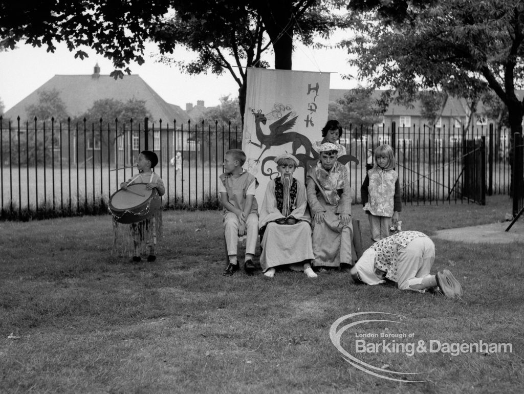 Rectory Library, Dagenham production of ‘The Price of Wisdom’ in grounds of library, produced by Mrs Jean Hickman, showing player salaaming before ’emperor’, 1969