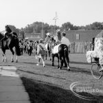 Mounted rider leading other horses and decorated bicycles at the Barking Carnival, 1969