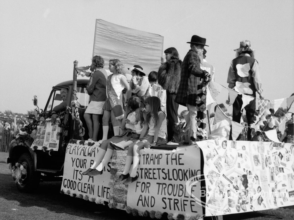 Crowds on a carnival float at the Barking Carnival, 1969