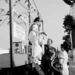 The Beauty Queen getting down from a carnival parade float at the Barking Carnival, 1969