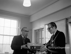 Barking and Dagenham Chamber of Trade and Industry showing Mr Andrews and Mayor Vic Rusha in Museum Room, Valence House, Dagenham at the handover of old minute books, et cetera, from the former three separate Chambers, 1970