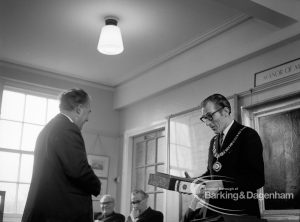 Barking and Dagenham Chamber of Trade and Industry showing a former president handing over documents to Mayor Vic Rusha in Museum Room, Valence House, Dagenham, 1970