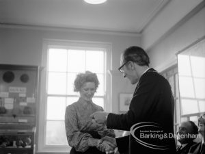 Barking and Dagenham Chamber of Trade and Industry showing winner of a competition in lettering receiving £25 cheque from Mayor Vic Rusha in Museum Room, Valence House, Dagenham, 1970