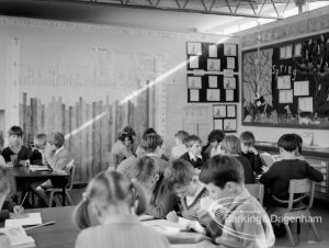 New William Bellamy Primary School, Becontree Heath, showing north-east corner of classroom, with decorated board and children seated around tables, 1970