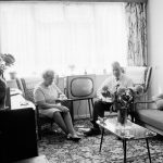 Housing at Grand Courts, Valence Wood Road, Dagenham, showing couple seated by window in lounge at flat, 1970