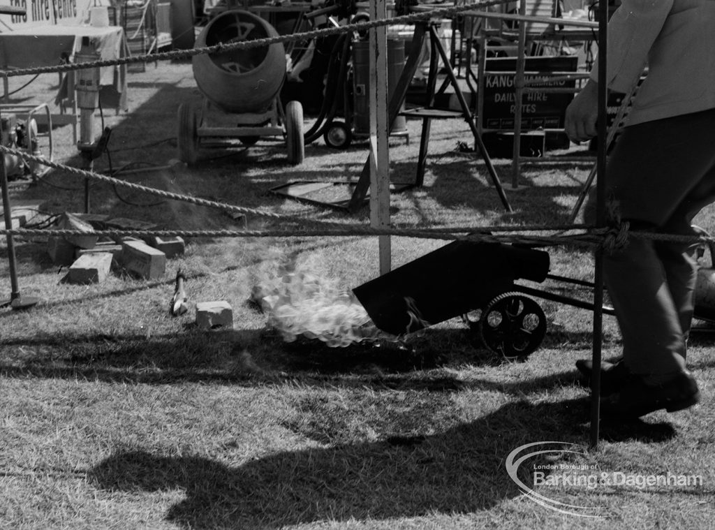 Dagenham Town Show 1970, showing laying of concrete, and man on right, 1970