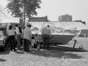Dagenham Town Show 1970, showing visitors looking at a boat under a tree, 1970