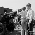 Dagenham Town Show 1970, showing two boys examining muzzle of field gun, 1970