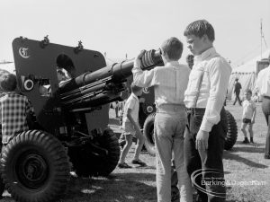 Dagenham Town Show 1970, showing two boys examining muzzle of field gun, 1970