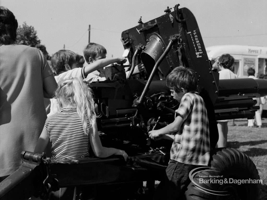 Dagenham Town Show 1970, showing children playing around field gun, 1970