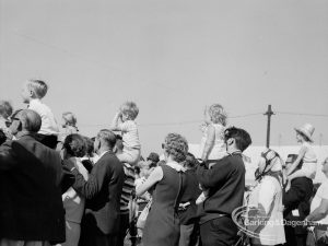 Dagenham Town Show 1970, showing group of spectators including several fathers holding up young children, 1970