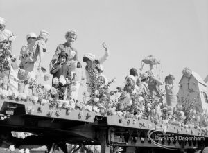 Dagenham Town Show 1970, showing women and children on long, richly decorated float, 1970