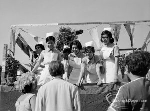 Dagenham Town Show 1970, showing nurses on float, listening and smiling to visitors, 1970