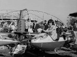 Dagenham Town Show 1970, showing fairground with young children in roundabout capsule, 1970