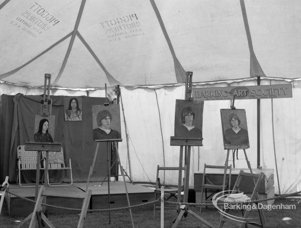 Dagenham Town Show 1970, showing easels with portraits just painted on Barking Art Society display, 1970