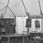Dagenham Town Show 1970, showing easels with portraits just painted on Barking Art Society display, 1970