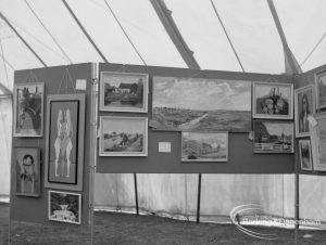 Dagenham Town Show 1970, showing landscape and other paintings on screens in Arts section display, 1970