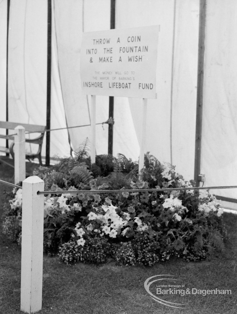 Dagenham Town Show 1970, showing Inshore Lifeboat Fund well surrounded by flowers, labelled ‘Throw a coin into the fountain and make a wish’, 1970