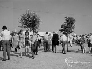 Dagenham Town Show 1970, showing groups of visitors walking about an avenue, 1970